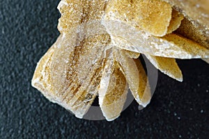 Desert Rose. Natural mineral close up of stone cluster from sand gypsum crystal. Macro