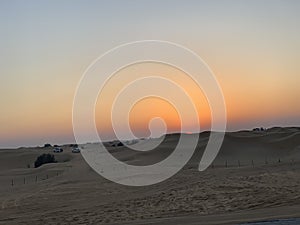 Desert safari on sunset in Dubai.