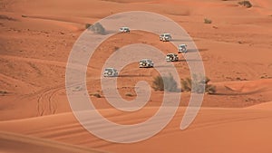 Desert Safari SUVs bashing through the arabian sand dunes 3