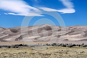 Desert sand dunes and blue sky