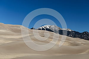 Desert sand dunes and blue sky