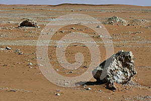 Desert sand in the heart of Saudi Arabia, rocks are also seen