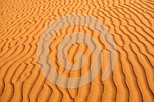 Desert sand textured patterns caused by wind