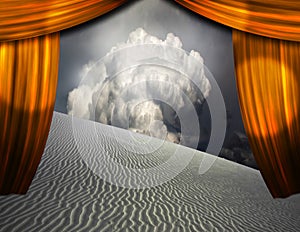 Desert sands seen through opening in curtains