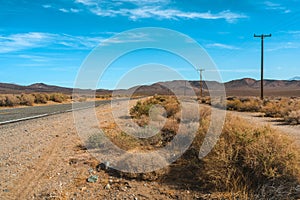 Desert scenic road in Death Valley with mountain backdrop, California, USA. Amazing natural panorama