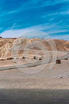 Desert scenic road in Death Valley with mountain backdrop, California, USA. Amazing natural panorama