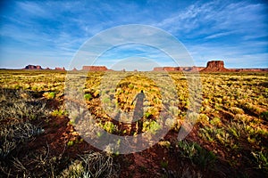 Desert Shadows and Mesas in Monument Valley with Photographer Silhouette