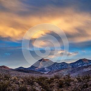 Desert southwest USA mountain landscape with a dramatic sky sunrise