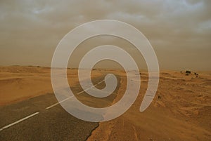 Desert storm on the road photo