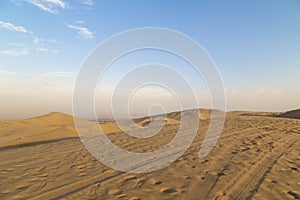 Desert during sunset at Huacachina Oasis in Ica, Peru