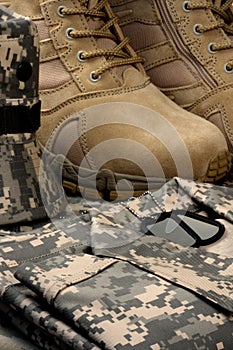 Desert tactical boots and military tag chains photo