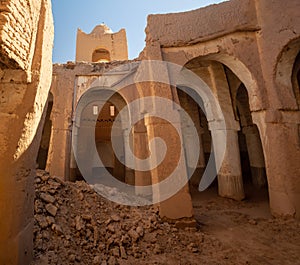 Desert town of Mhamid, Morocco village with sand dunes and old muslim mosque in north Africa, old narrow streets, traditional clay