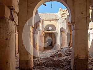 Desert town of Mhamid, Morocco village with sand dunes and old muslim mosque in north Africa, old narrow streets, traditional clay