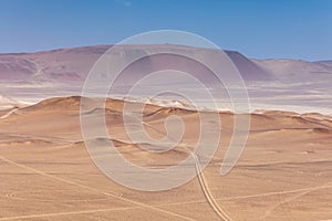 Desert view of the Paracas National Reserve, dunes, sands, roads. Peru.