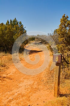 Desert walking trail and distance marker sign post