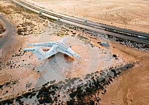 Deserted airplane in the in the Umm Al Quwain desert in the emirate of the United Arab Emirates