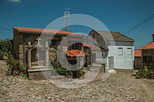 Deserted alley and old small house with stone walls