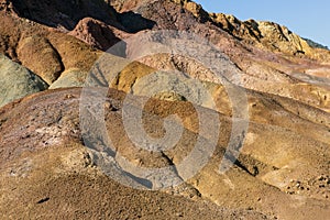 Deserted, arid and lifeless mountainous place, on a hot day at noon with strong sunlight