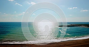 Deserted beach with crystal clear water on shores of Mediterranean Sea, aerial view sunset