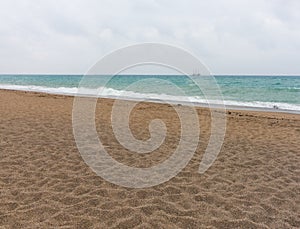 Deserted beach with footprints in the sand