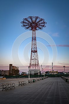 Deserted boardwalk in early morning silhouette of an empty Coney Island, Brooklyn, NYC, USA