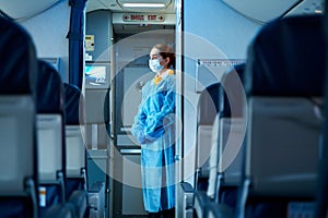 The deserted cabin of the plane, near the cockpit, a stewardess in a medical mask and a dressing gown will greet passengers. Air