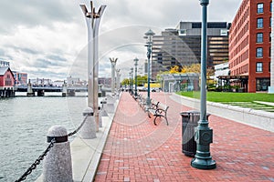 Deserted harbourside footpath on an overcast autumn day