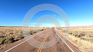 Deserted Highway in Arizona with Painted Desert