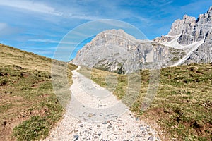 Deserted mountaintop path in the European Alps on a sunny autumn day