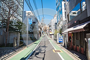 Deserted narrow street in a residential district in Tokyo, Japan, on a sunny day