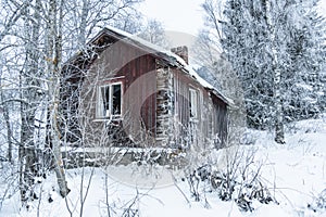 Deserted old timber house wintertime Sweden