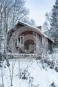 Deserted old timber house wintertime Sweden