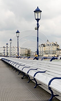 Deserted seats on pier in Eastbourne UK