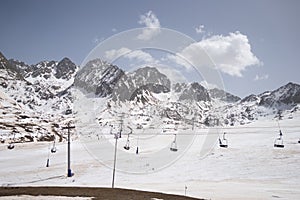Deserted ski slopes in the middle of the coronavirus pandemic, view of the cable cars