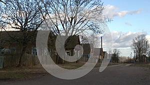 A deserted street in the village, a change in light, a timelapse. Concept: link to the countryside, single homes.