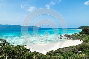 Deserted tropical island beach and clear blue water, southern Japan