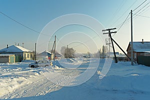 Deserted village street on a winter day