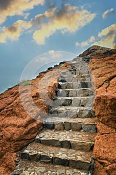 Volcanic rock with stone stairs towards the sky