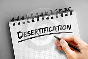 Desertification text on notepad, concept background