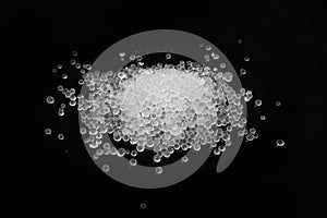 Desiccant Silica Gel Adsorbent Crystals on Black Background, Desiccant Polymer Balls