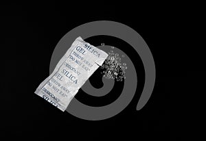 Desiccant Silica Gel Adsorbent Crystals on Black Background, Desiccant Polymer Balls