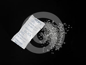 Desiccant Silica Gel Adsorbent Crystals on Black Background, Desiccant Polymer Balls