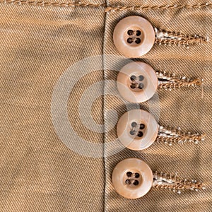 Design botton of brown shirt on fabric textile