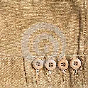 Design botton of brown shirt on fabric textile