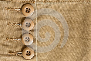 Design botton of brown shirt on fabric textile