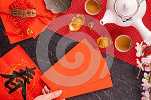 Design concept of Chinese lunar January new year - Woman holding, giving red envelopes ang pow, hong bao for lucky money, top