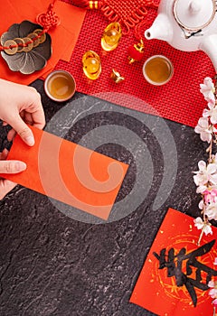 Design concept of Chinese lunar January new year - Woman holding, giving red envelopes ang pow, hong bao for lucky money, top