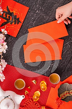 Design concept of Chinese lunar January new year - Woman holding, giving red envelopes ang pow, hong bao for lucky money, top