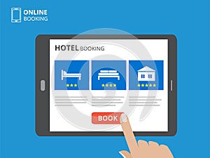 Design concept of hotel booking online. Tablet computer with hand touching a screen. Display with book button and bed