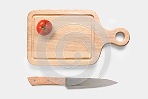 Design concept of mockup tomato on cutting board and knife set